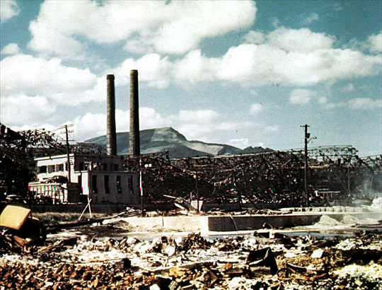 Mitsubishi Factory
Ruins in the foreground are of the Mitsubishi shipbuilding factory. The white building housed the sawmill. The double smoke stacks are a part of the steel mill. This factory is about 4,750 feet (1,450 meters) south of the hypocenter.
