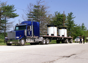 Members of the Public Utilities Commission of Ohio Inspect the First Shipment of Treated Low-Level Radioactive Waste from Fernald's K-65 Silos. Approximately 2,000 Shipments Will Travel 1,340 Miles to a West Texas Storage Facility Until the End of the Year.
Keywords: Fernald Closure Project Fernald Green Salt Plant, Feed Materials Production Center, Fernald, Ohio (FEMP)