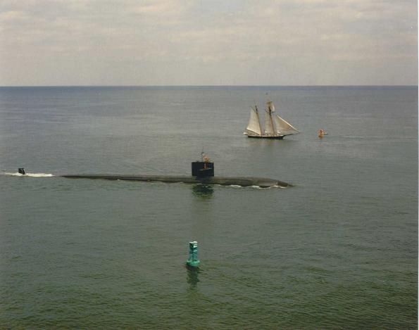 Baltimore Fleet
The ships of the Baltimore Navy meet in Chesapeake Bay.  The USS Baltimore, SSN 704, and The Pride of Baltimore were photographed as Pride set out on a world cruise where she was lost in a storm.  MM1(SS) Bierkortte (not visible) was on the bridge.
