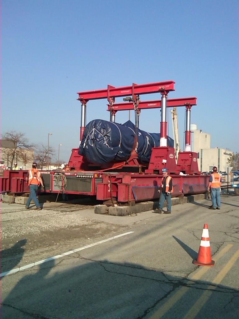 Loading pump  # 2
This is Barnhart loading the sodium pump from the Goldhofer (loader)  to the gantry crane to be lifted, then, the gondola is  moved under the pump and the pump is lowered into the gondola.
