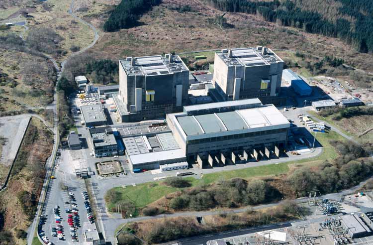 Trawsfynydd
Trawsfynydd Power Station lies within the boundaries of a National Park of considerable beauty and is located on the northern bank of Llyn Trawsfynydd. 

Following the decomissioning of the plant, the existing building structure is to be reduced in height and encased in a new 'Safestore' envelope. The objective is to reduce and in some cases eliminate the buildings impact within the National Park.

The Safestore structure is to provide an aesthetically acceptable, cost effective means of long term, secure storage for specific radioactive materials and structures. As well as minimising the visual impact of the site the structure is based on the following criteria:

The design life shall be 135 years. During the majority of this period it is proposed that the site will be unmanned. The structures shall be intruder resistant with a 9m wall also giving an improved visual balance between the lower and upper levels of the external elevations. 
 
The landscape within the site boundary will reflect the character of the natural surrounding landscape so the there are no visible boundaries and the landscape flows naturally through the site.
Keywords: Trawsfynydd Safestore UK