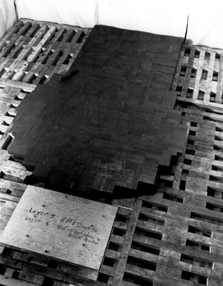 Chicago Pile One - Level 7
The 7th layer of graphite and edges of 6th layer containing 3-inch pseudospheres of black uranium oxide. Beginning with layer 6, alternate courses of graphite containing uranium metal and/or uranium oxide fuel were separated by layers of solid graphite blocks.
Keywords: Chicago Pile One
