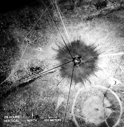 Aerial View of the Trinity Test Site
This photo was taken 28 hours after the explosion, at ground zero. The circle at bottom right is where the 100-ton test was conducted on May 7, 1945. 
