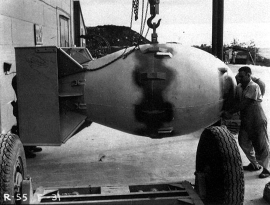Fat Man on Tinian
The Fat Man bomb being readied on Tinian.

The rapid spontaneous fission rate of plutonium 239 necessitated that a different type of bomb be designed. A gun-type bomb would not be fast enough to work. Before the bomb could be assembled, a few stray neutrons would have been emitted, and these would start a premature chain reactionleading to a great reduction in the energy released.
