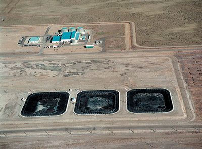 Liquid Effluent Retention Facility
The three basins shown in this photo of the Liquid Effluent Retention Facility are lined with two, flexible, high-density polyethylene membranes.

This facility consists of three RCRA-compliant surface basins that temporarily store liquid waste, including condensate from the 242-A Evaporator. Approximately 32.7 million liters (8.6 million gallons) of liquid waste were stored in the facility's basins at the end of 2001.

Keywords: Hanford Reservation, Richland, Washington