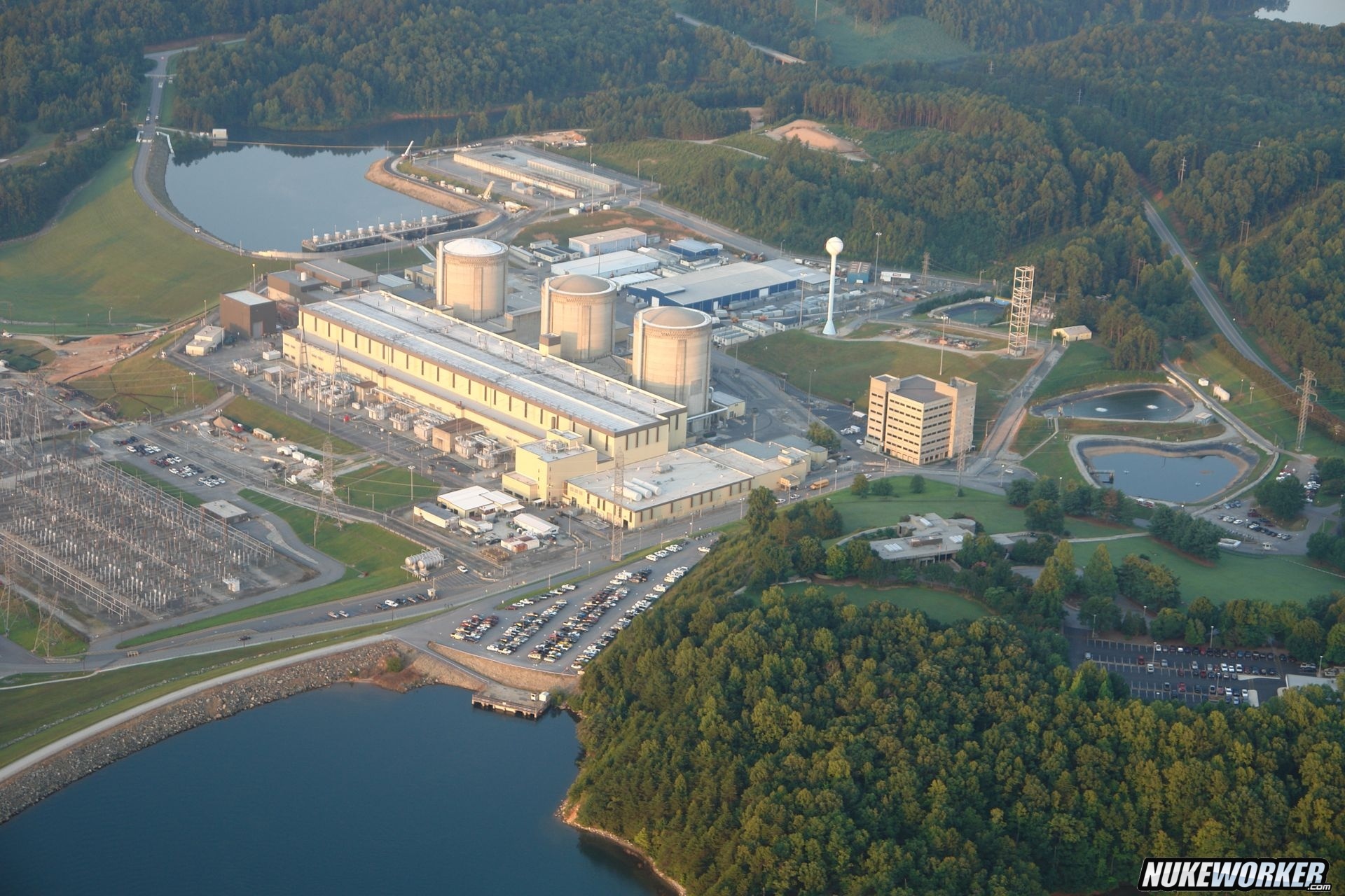Oconee Nuclear Station
Oconee Nuclear Station, located on Lake Keowee near Seneca, South Carolina, approximately eight miles north of Clemson, is a three-unit nuclear facility. Commercial operations began with Unit 1 in 1973, followed by Units 2 and 3 in 1974. The station’s three pressurized water reactors (PWRs) have a combined generating capacity of 2,554 megawatts—enough to power more than 1.9 million homes. Since beginning operations, Oconee has achieved several industry milestones, including:
Establishing the nation’s first accredited nuclear operator training program
Becoming the first nuclear station to generate 100 million kilowatt-hours of electricity
Achieving over 3 million safe work hours
Earning recognition as the second nuclear station in the United States to receive a 20-year operating license extension from the NRC (Calvert Cliffs preceded it)
