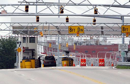 Y-12 nuclear weapons plant in Oak Ridge, Tenn
A security guard checks indentification of a driver entering the Y-12 nuclear weapons plant in Oak Ridge, Tenn., Friday, July 2, 2004. A series of overhead barriers have been installed to stiffen the plant's defenses. Y-12, which makes parts for every warhead and is the main storehouse for bomb-grade uranium, has been criticized for lax security.
Keywords: Y-12 nuclear weapons plant in Oak Ridge, Tenn