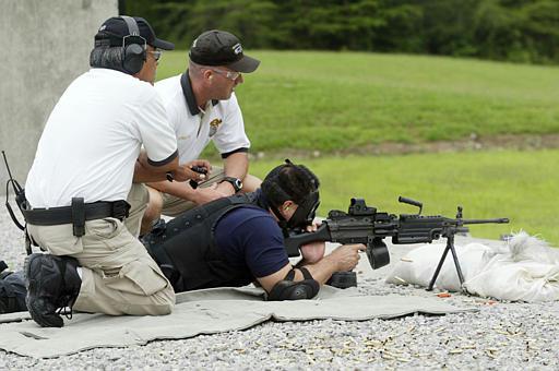 Y-12 nuclear weapons plant
With instructors watching, a security patrol officer receives training on a M249 machine gun at the Central Training Facility of the Y-12 nuclear weapons plant Friday, July 2, 2004 in Oak Ridge, Tenn. The Department of Energy facility has been beefing up security since a critical report in January. At DOE's request, the instructors and officer are not identified.
Keywords: Oak Ridge Y-12 National Security Complex