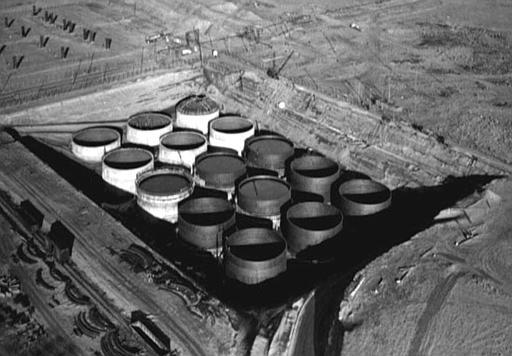SX Tank Farm at Hanford Nuclear Reservation
The SX Tank Farm at Hanford Nuclear Reservation, near Yakima, Wash., is shown under construction in this 1953 file photo. Scientists have discovered bacteria living in the toxic sediment beneath underground tanks that have leaked radioactive waste at the Hanford nuclear reservation, home to some of the most highly contaminated soil in the world.
Keywords: Hanford Reservation, Richland, Washington