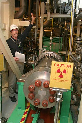 Davis Bessie Nuclear Power Plant
Project Manager John O'Neill explains the purpose of the upgraded #1 High Pressure Injection Pump at the Davis-Besse Nuclear Power Station in Oak Harbor, Ohio, Friday, Feb, 27, 2004. The injection pumps are part of a safety backup coolant system to be used in the event of a cooling accident. The power station has been shut down for two years while the reactor head was replaced due to corrosion.
Keywords: Davis Bessie Nuclear Power Plant