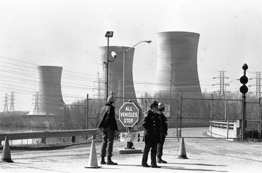Three Mile Island nuclear power plant
A Pennsylvania State policeman and plant security guards stand outside the closed front gate to the Metropolitan Edison Nuclear Power Plant on Three Mile Island near Harrisburg, Pa. after the plant was shut down following an accident in the plant. Some radiation escaped into the atmosphere Wednesday, March 23, 1979. In background are the plant's cooling towers.
Keywords: Three mile Island Nuclear Power Plant (TMI) near Harrisburg Pa in Middletown Penn