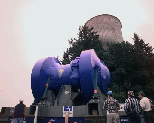 Trojan Nuclear Power Plant (decommissioned)
Workers watch as the reactor vessel, covered in blue shrink-wrap, slowly moves past the Trojan Nuclear Power Plant cooling tower on the way to a barge in the Columbia River near Rainier, Ore., Friday, Aug. 6, 1999. The reactor vessel will travel by river to southeast Washington state where it will be buried at Hanford Nuclear Reservation. Trojan was shut down in 1993.
Keywords: Trojan Nuclear Power Plant Rainier Ore (decommissioned)