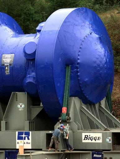 Trojan Nuclear Power Plant (decommissioned)
Workers look to secure the Trojan Nuclear Power Plant reactor vessel, covered in blue shrink-wrap, to a barge on the Columbia River near Rainier, Ore., Friday, Aug. 6, 1999. The reactor vessel will travel by river to southeast Washington state over the weekend where it will be buried at Hanford Nuclear Reservation. Trojan was shut down in 1993 
Keywords: Trojan Nuclear Power Plant Rainier Ore (decommissioned)