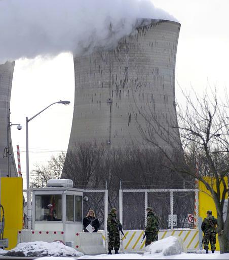Three Mile Island
Military personnel guard the front gate to the Three Mile Island nuclear power plant. The FBI and the National Infrastructure Protection Center issued a bulletin Wednesday to companies involved in such industries as telecommunications, energy, and banking and finance, as well as operators of water systems and electric utilities, law enforcement agencies and emergency services. Officials believe al-Qaida could target these entities with chemical, biological or radiological attacks.
Keywords: Three mile Island Nuclear Power Plant (TMI) near Harrisburg Pa in Middletown Penn