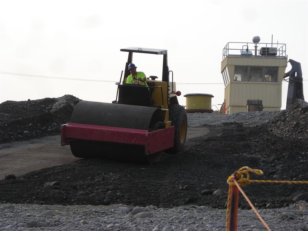 Brian Tate
Rolling the ramp extending down into the excavation north of 105N during the back fill.
