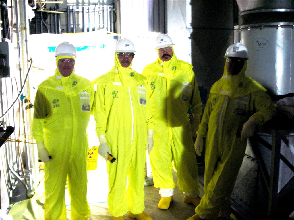 Hanford, 105N
Bob Lewis, Mark Welling, Mark Sims and, in the deep shadows our Rad Eng Mitch Kobierowski.  Touring room 505 prior to demo to evaluate the radiological risks.  Oct 6, 2009
