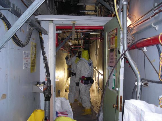 100N 105N 0' corridor 7
Asbestos abatement crew setting up
