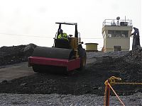 Brian_Tate,_rolling_ramp_into_excavation_105N_north_side,_Aug_2,_2010.JPG