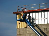 Mark_Schaffer,_removing_sheet-metal_from_105N_east_wall.JPG