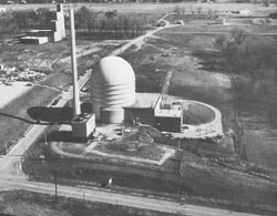 Wright-Patterson Air Force Base Bldg. 470
The Nuclear Engineering Test Facility resulted from a 1954 Air Force initiative to develop a nuclear powered aircraft. Construction began in 1956 and continued despite cancellation of the nuclear propulsion project the next year. When completed in 1960, the light water cooled test reactor was the Air Force's only research reactor and the seventh largest of its kind in the nation. It had a ten megawatt capacity and could accommodate a full scale jet engine. Its internal facilities were not completed until 1965, the same year the Air Force Institute of Technology accepted operational control and safety responsibility for the reactor. The reactor's first nuclear chain reaction was achieved in April 1965. AFIT, civilian institutions, and Department of Defense agencies used the reactor for a variety of projects, ranging from biomedical studies to solid-state electronics. The reactor was operated for the last time on June 12, 1970 and decommissioned in June 1971.
Keywords: Air Force, Ohio, Reactor, decommissioned