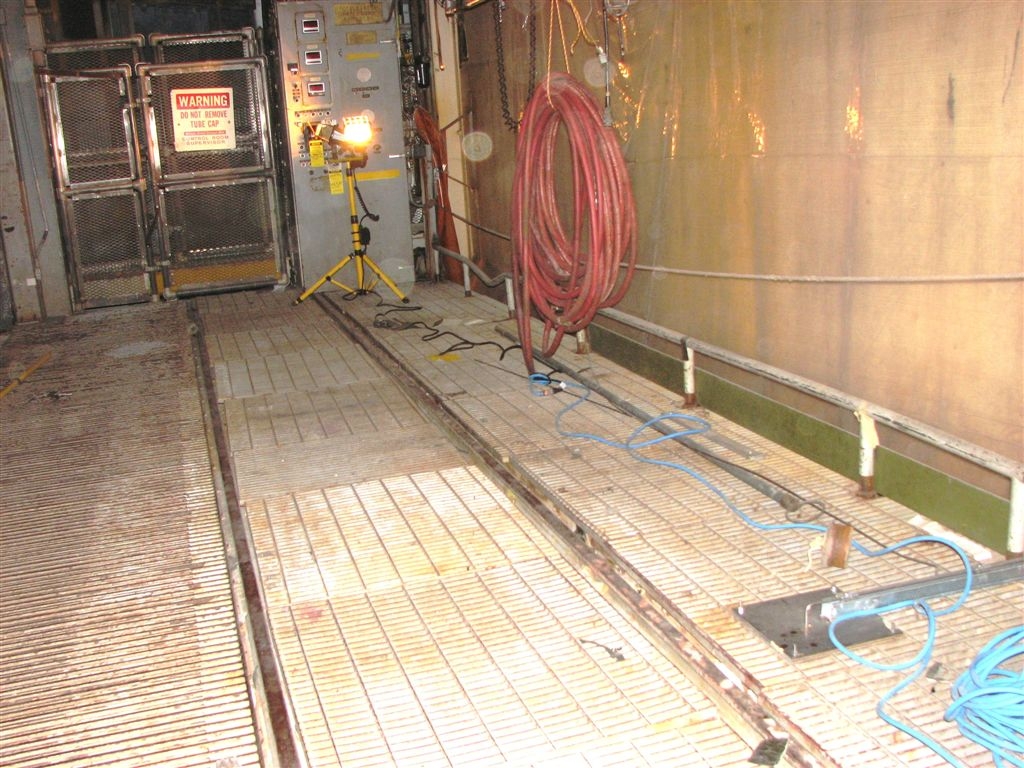 C-elevator
Looking across the elevator's floor which is made of steel grating.
