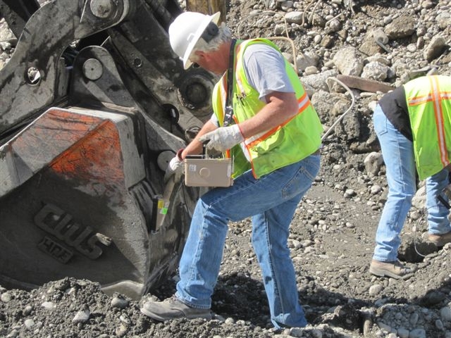 Jack Conrad
Checking the excavator's bucket.  

