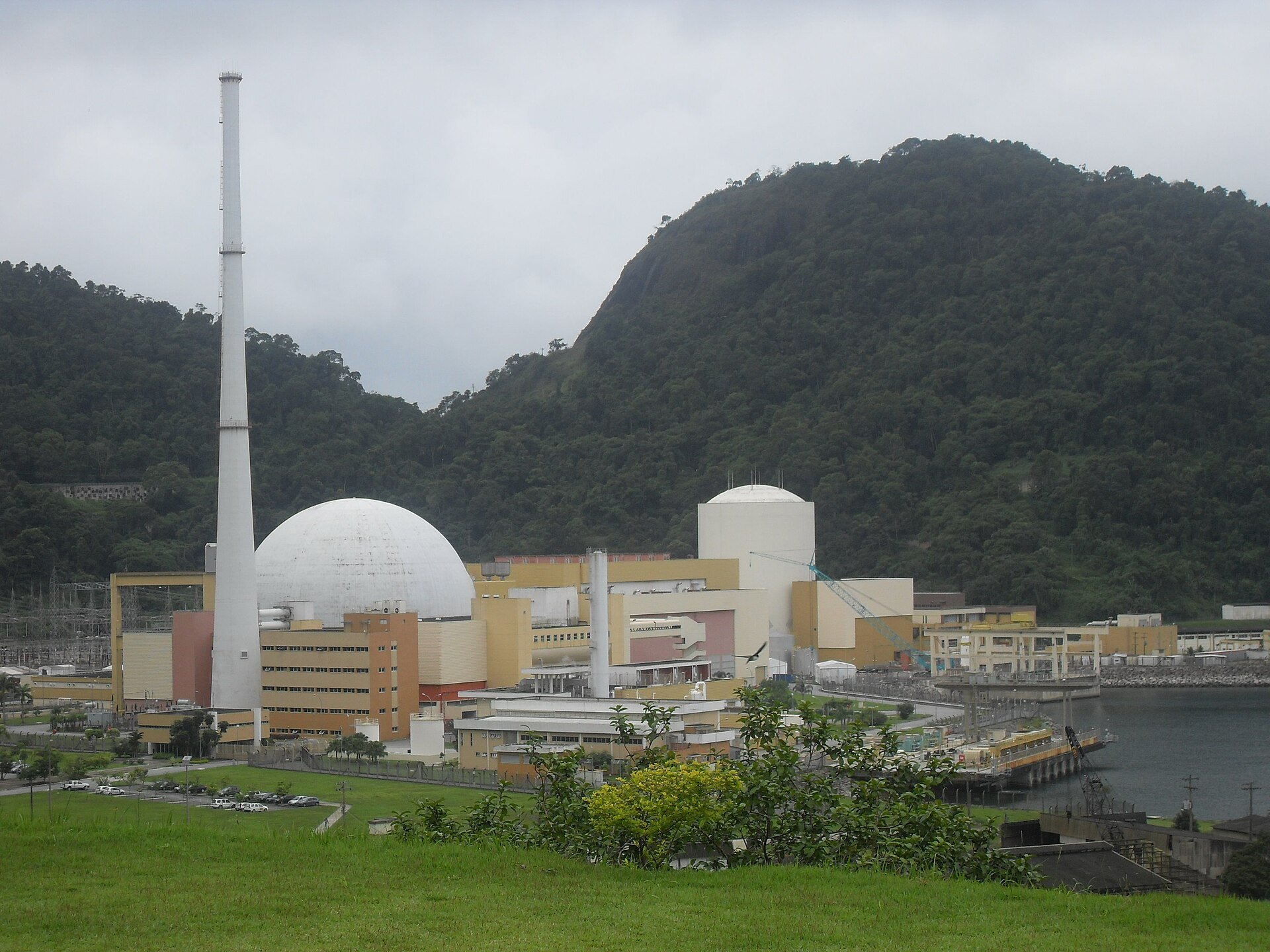 Angra nuclear plant with tall chimney and hill