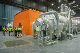 Almaraz orange housing and pipework with visitors