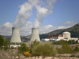 Cofrentes towers with steam above scrubland