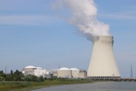 Doel cooling tower above white tanks and road